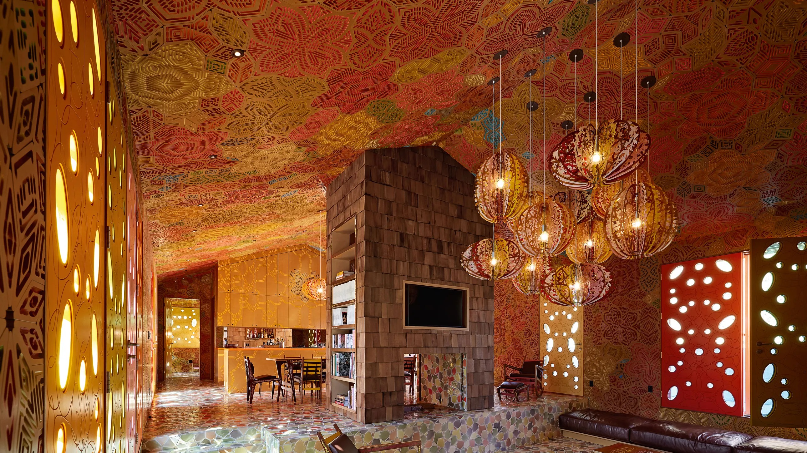 Malibu Ranch House: sunken living room under a patterned CNC-engraved ceiling